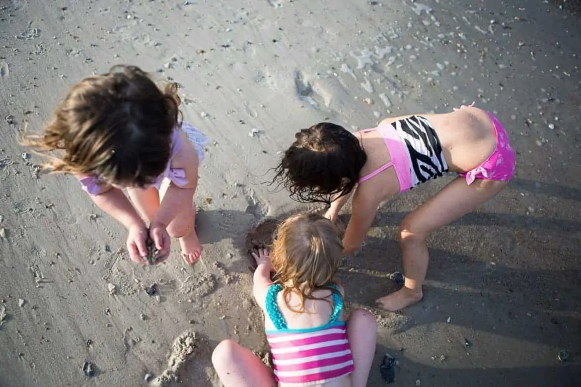 Young girls playing in the sand at the beach Summer Emergency Preparedness Kit