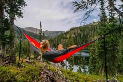 woman on hammock near the river relax