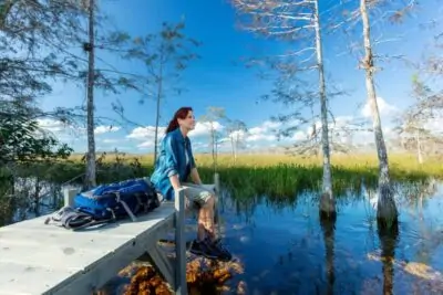 Woman Sitting on Dock in the Everglades scaled
