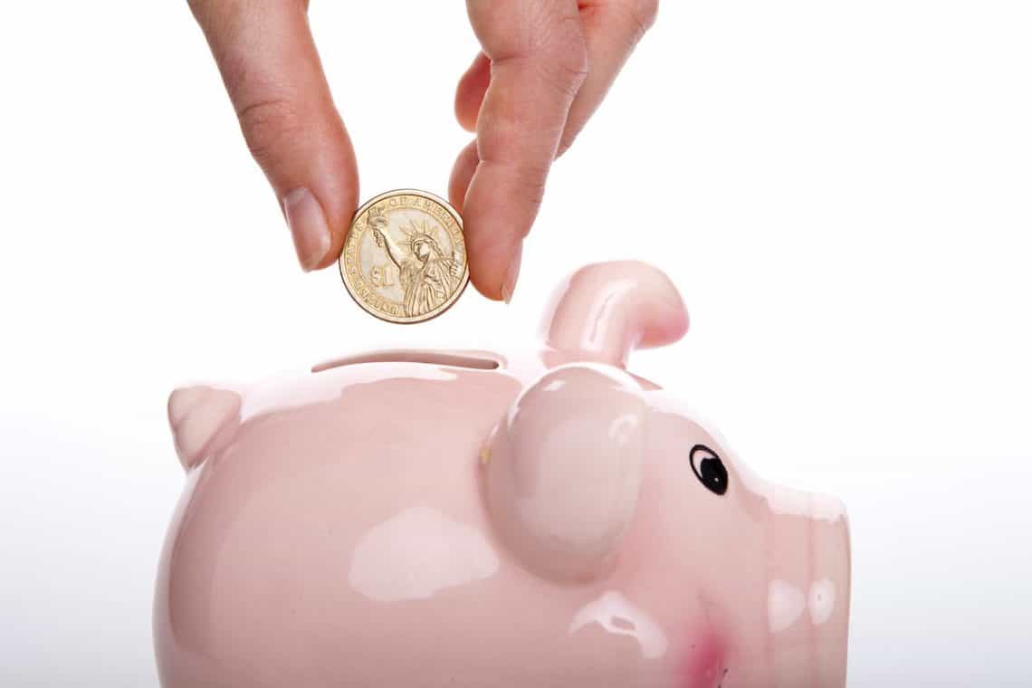 putting coins in a piggy bank creative ways to save money