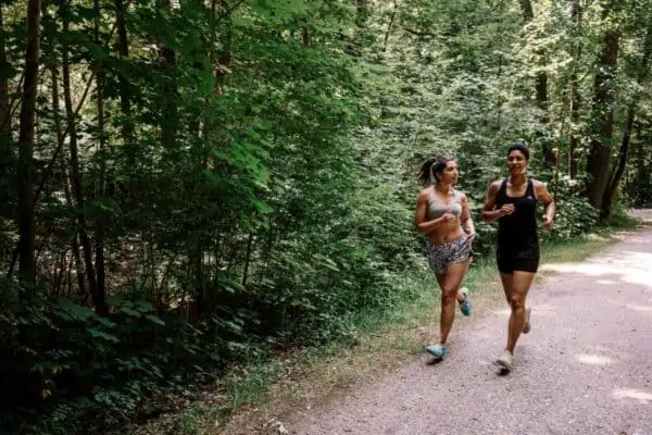 two women going for a run in a park cardio -  - 7 Ways To Create a Functional Fitness Routine