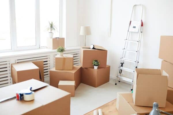 moving boxes in an empty white room