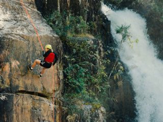 rock climbing near a waterfall